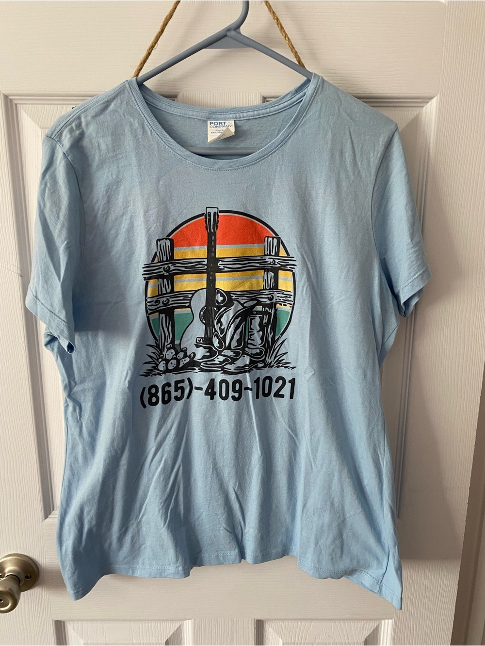Light Blue Graphic Tee with Sunset Guitar Design